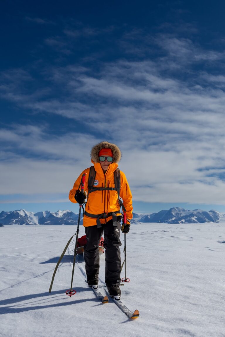 Andy skiing while pulling her 240 pound sled