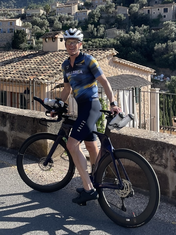 Dale with his bicycle on an Ironman training ride