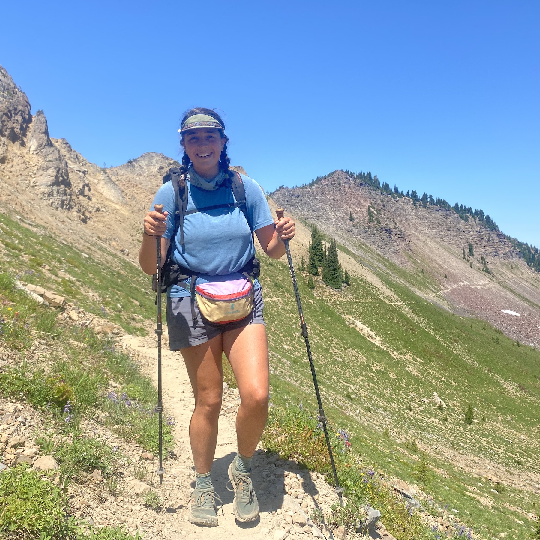 Grace traversing a beautiful mountain trail