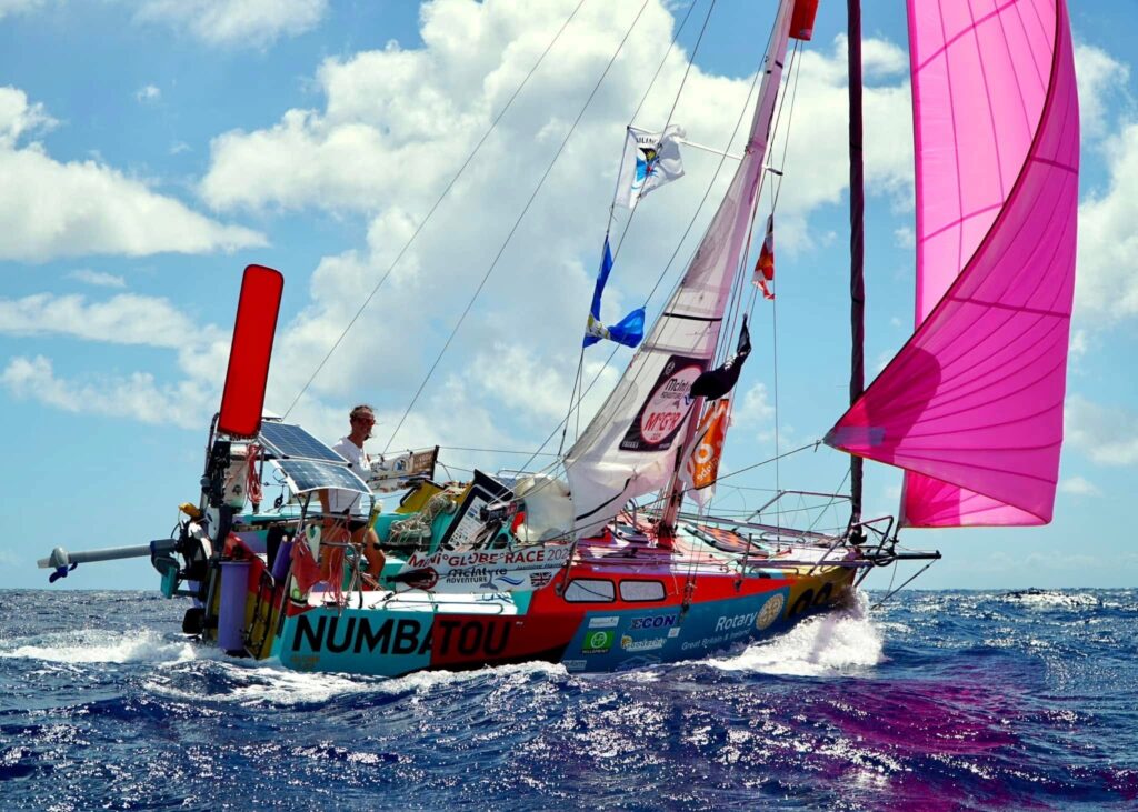 Jasmine at sail in her colorful boat
