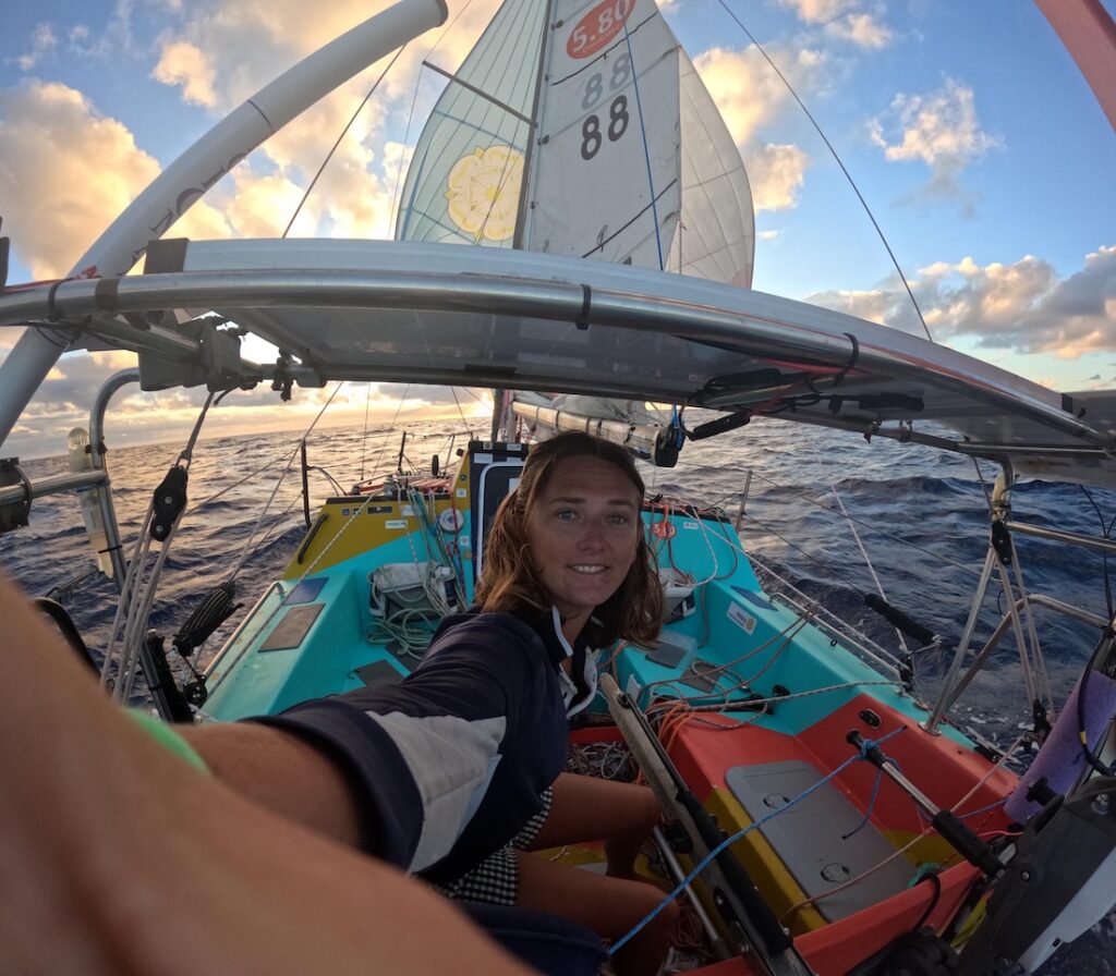 Jasmine in the cockpit of her sailboat