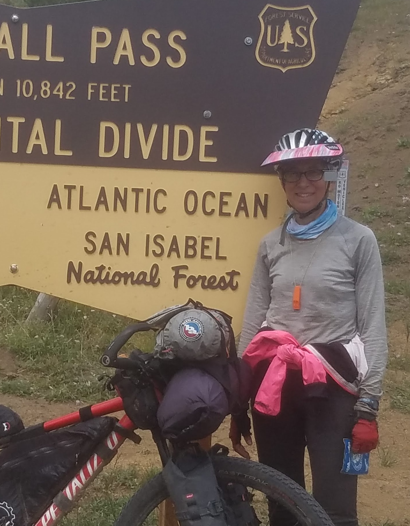 Jeri and her bike on the Continental Divide