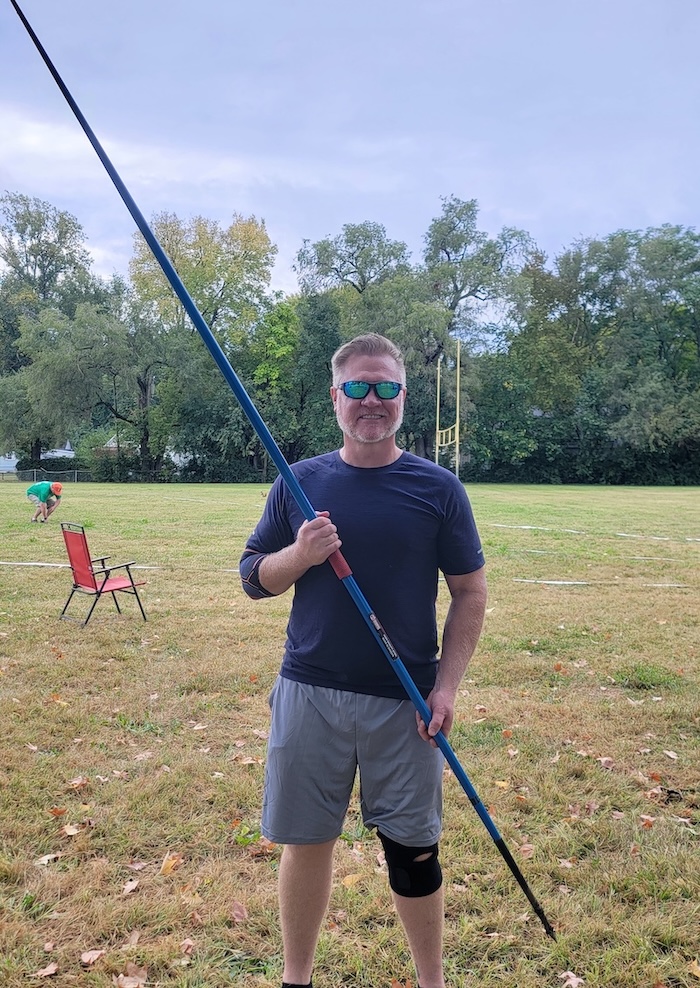 Larry holding his javelin