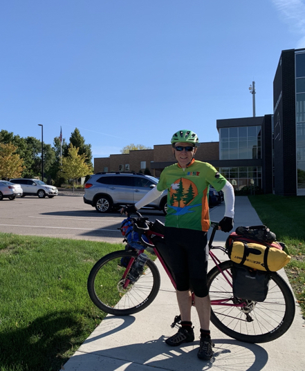 Rolf and his bike in front of a county courthouse