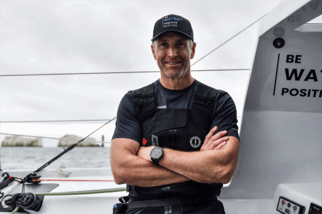 Skipper Scott Shawyer of Skipper looking out from the cockpit of Canada Ocean Racing