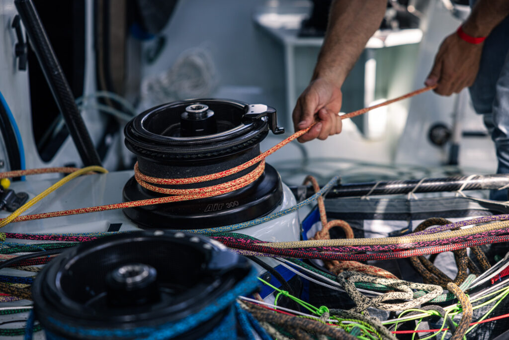 Winch and lines of Skipper looking out from the cockpit of Canada Ocean Racing's sailboat