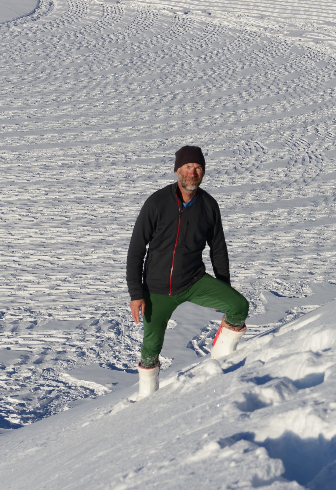 Simon posing by his snow drawing