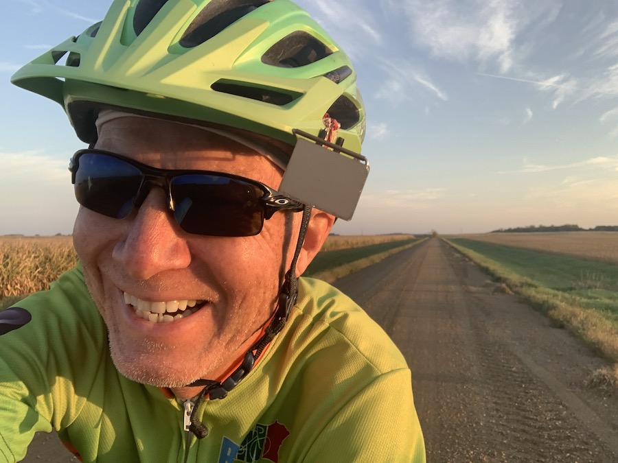 Rolf's selfie while riding his bicycle down a rural highway