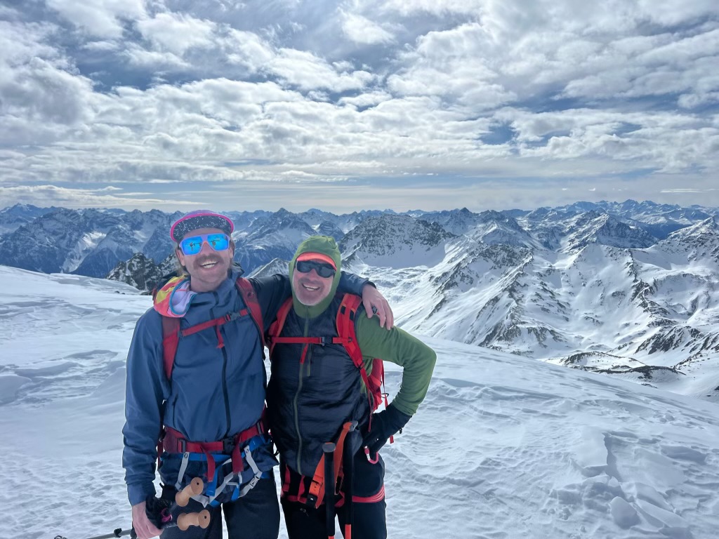 Dave and his ski touring pal with the Swiss Alps in the background.