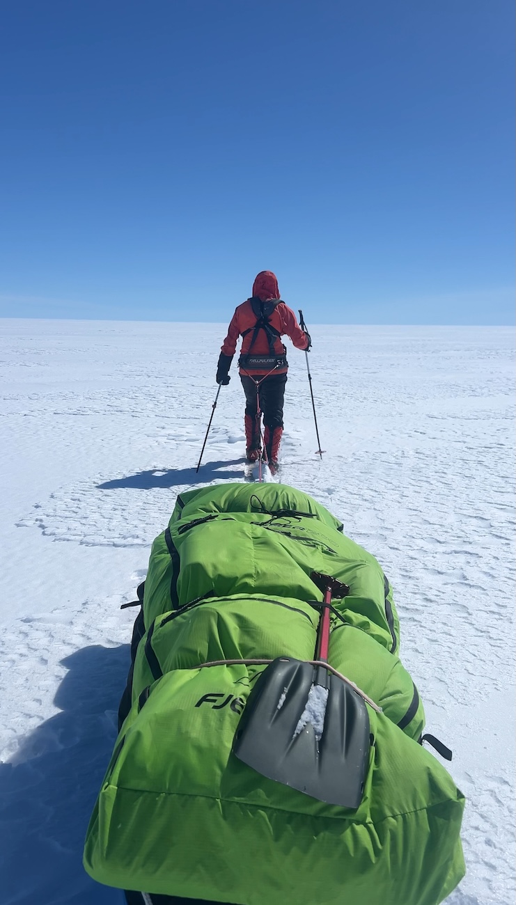 Pulling a pulk sled across the endless Greenland Icecap