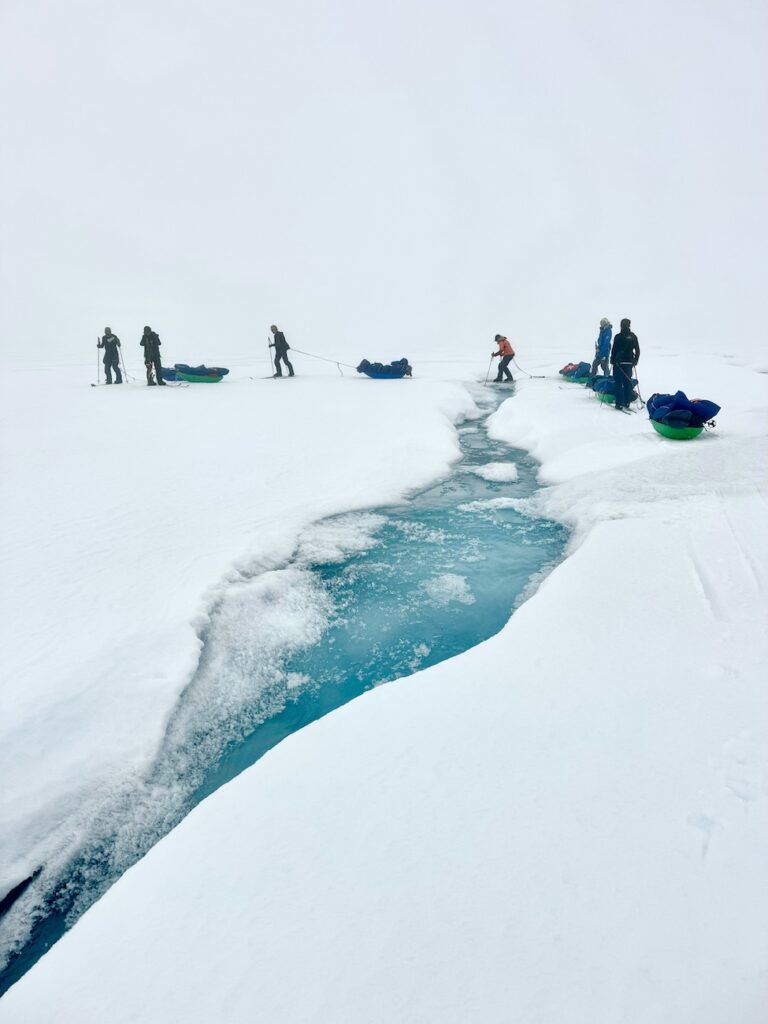 Crossing open water on skis with sleds