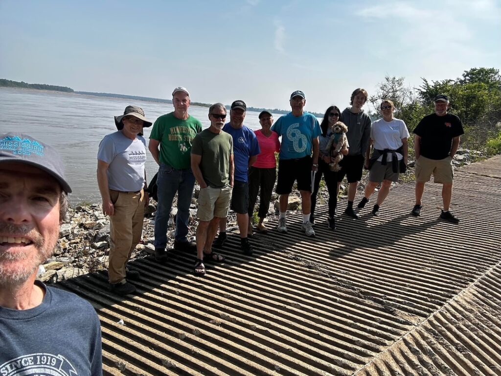 The Mississippi River speed record support team by the river