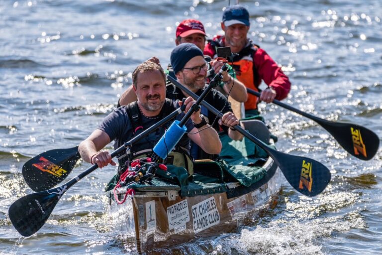 Action shot with all 4 people paddling