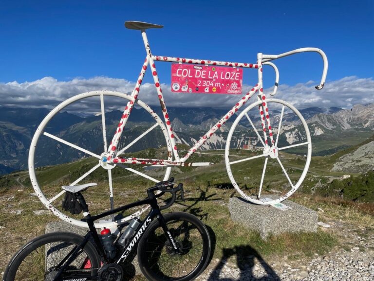 Bike statue at a mountain pass