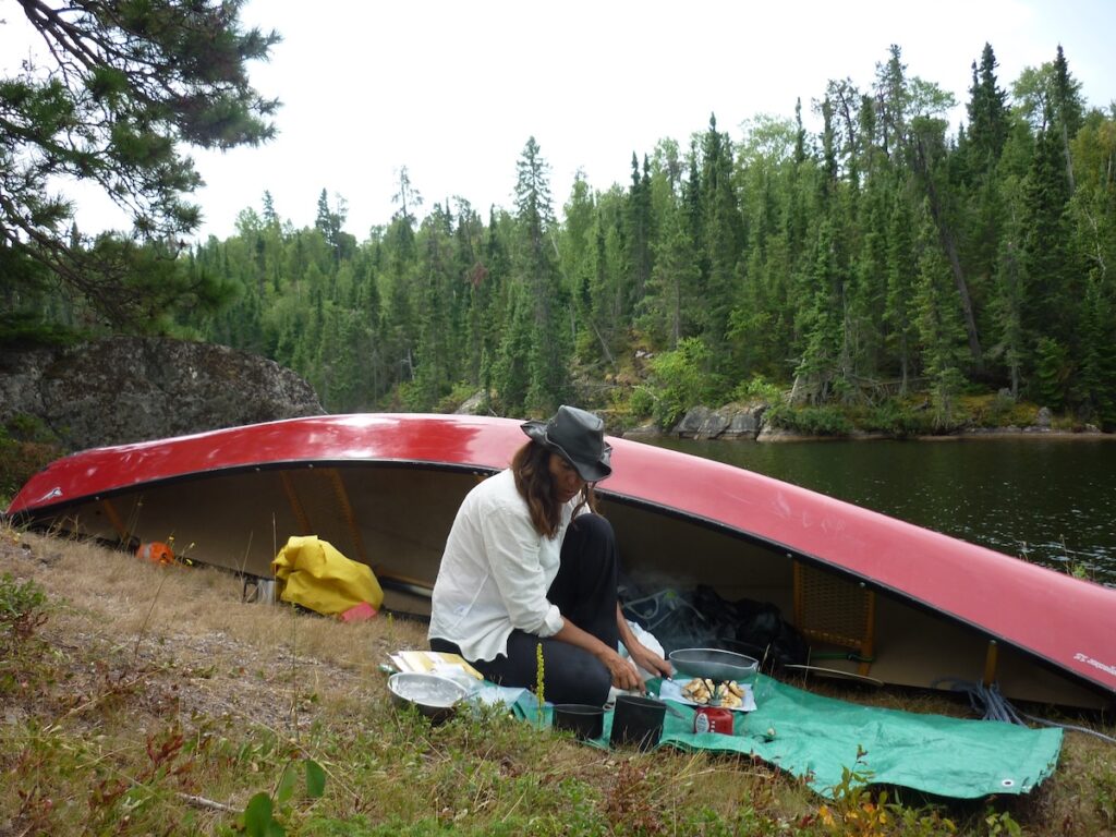 Dianne ashore with her red canue