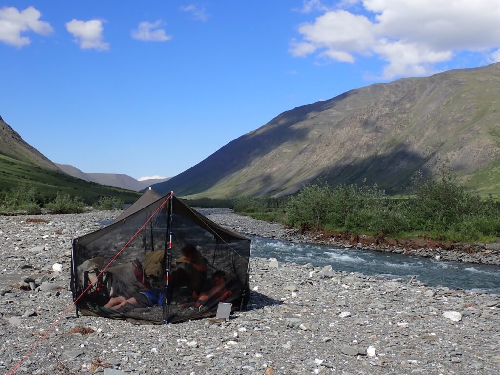 Camped in a bug tent along the river
