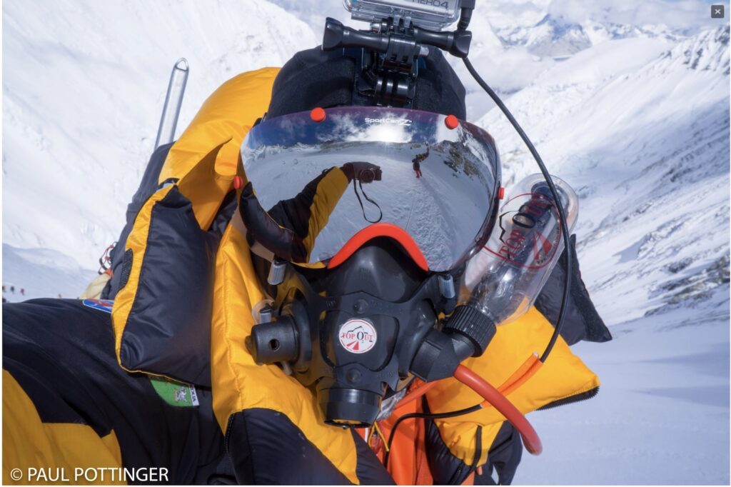 Paul taking a masked selfie on Mt. Everest