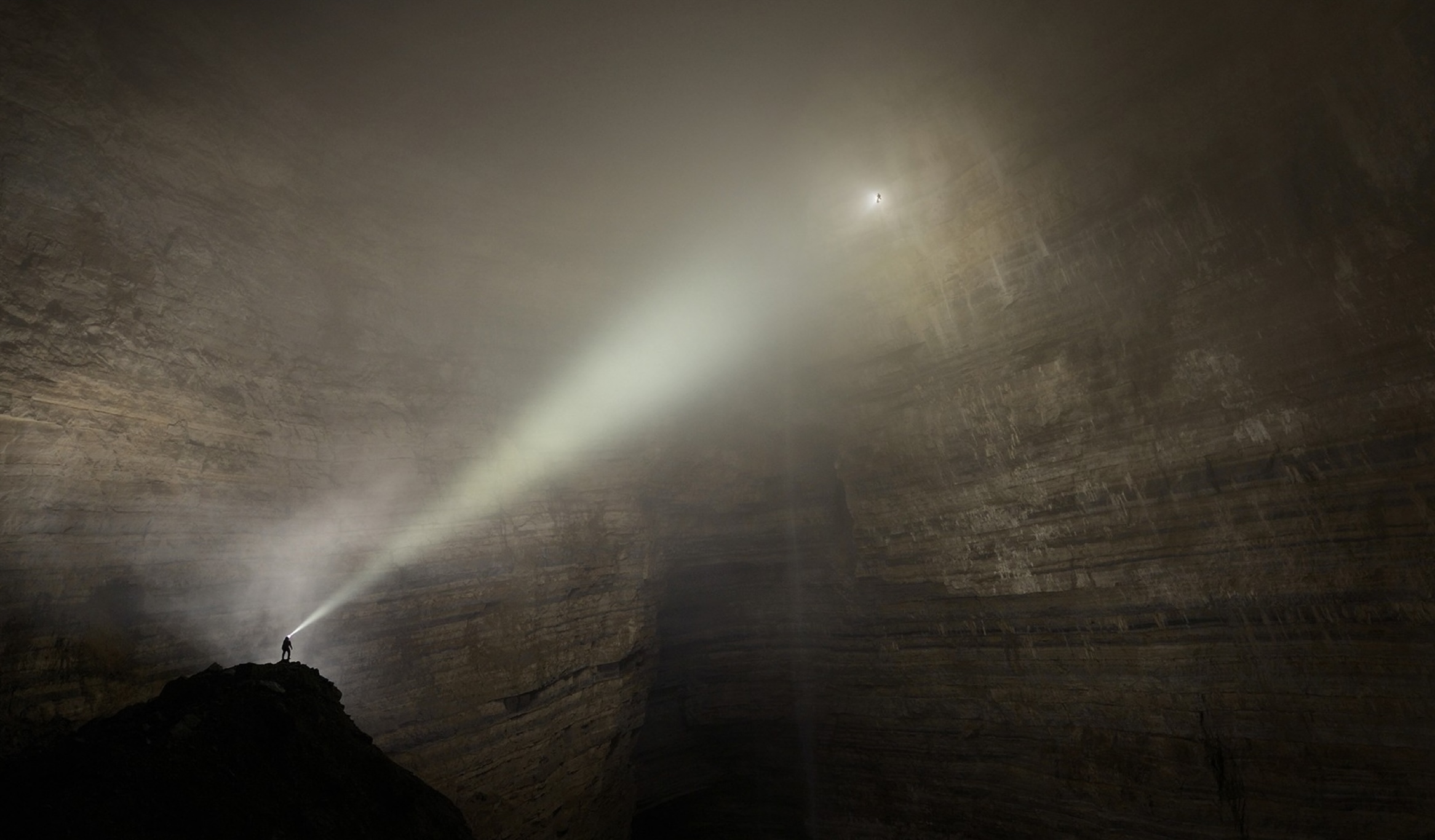 Spotlight photo in a massive cavern