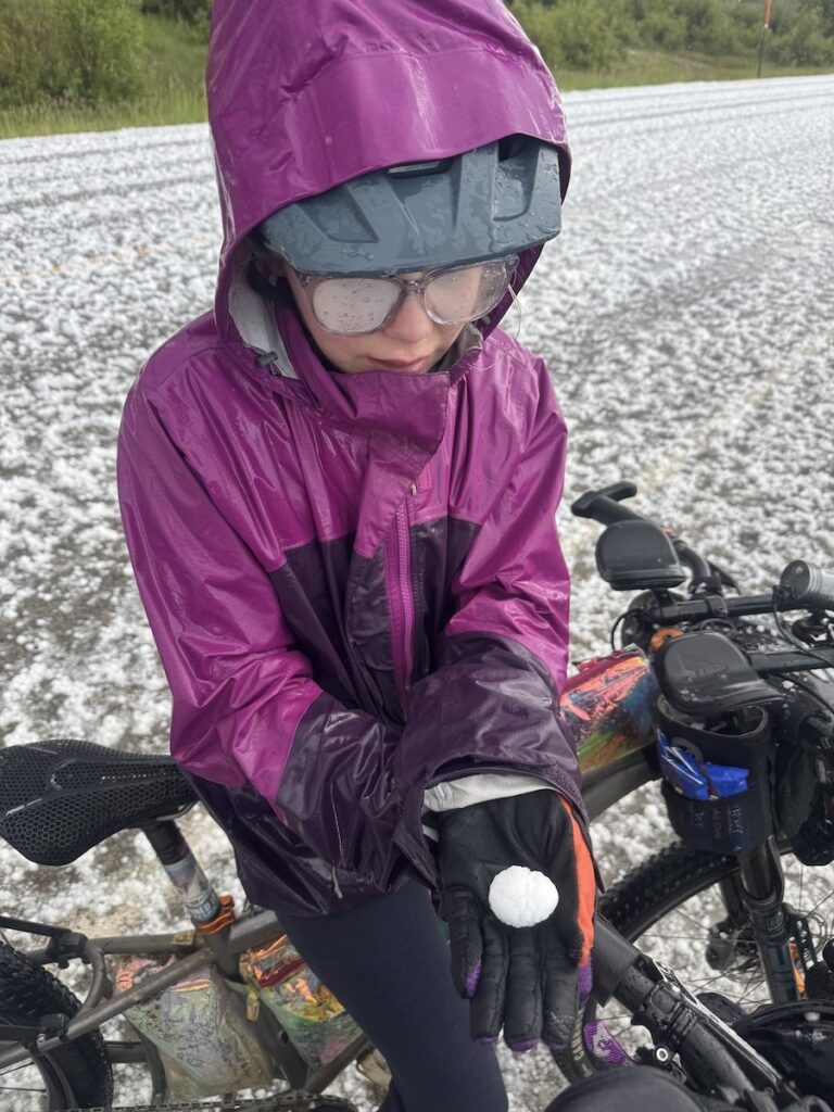 Molly holding a golfball sized hail stone