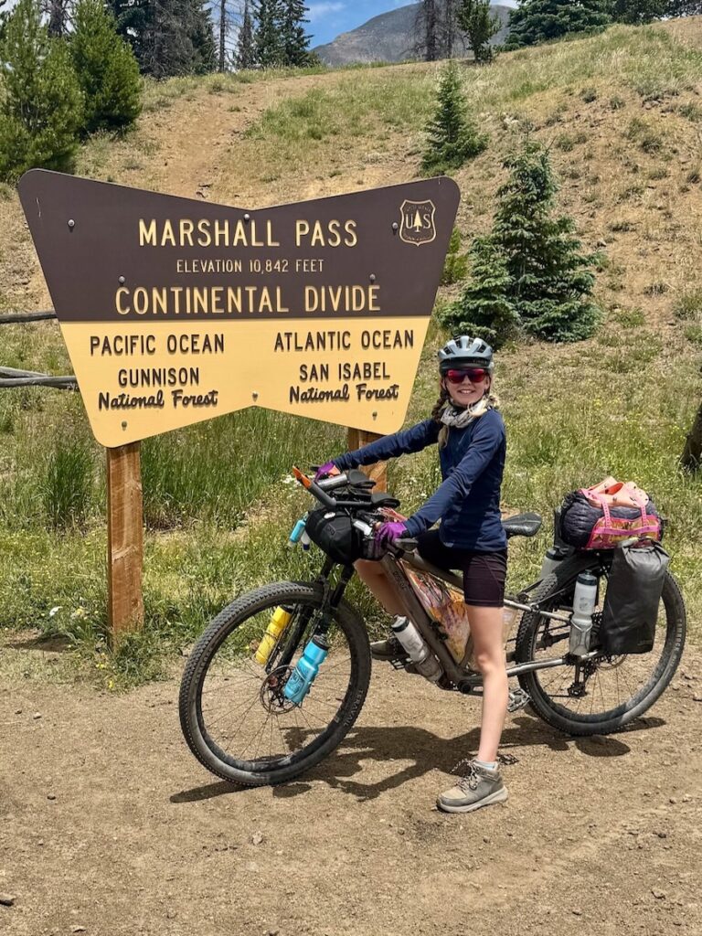 Molly at the Marshall Pass sign on the Continental Divide