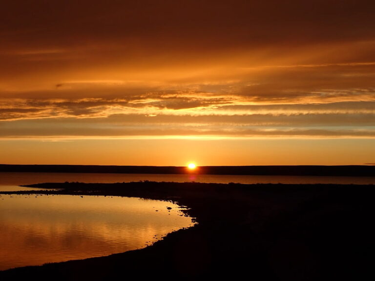 The arctic sun touching the horizon