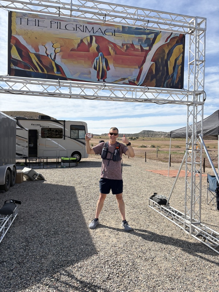 Me at the finish line with my finisher's belt buckle