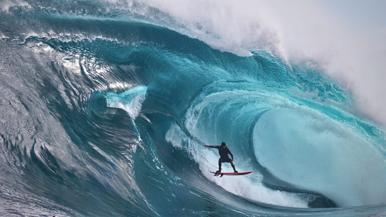 Surfer in a green/blue barrel wave at Shipsterns
