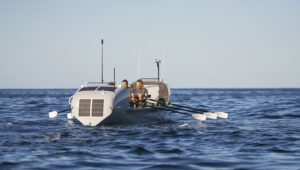 The 3 Maclean brothers at sea rowing