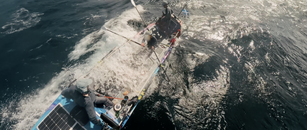 Maclean brothers rowing in breaking waves