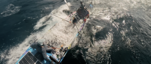 Maclean brothers rowing in breaking waves