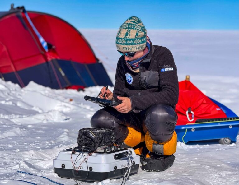 Dr. Heidi Sevestre working with her research in Antarctica