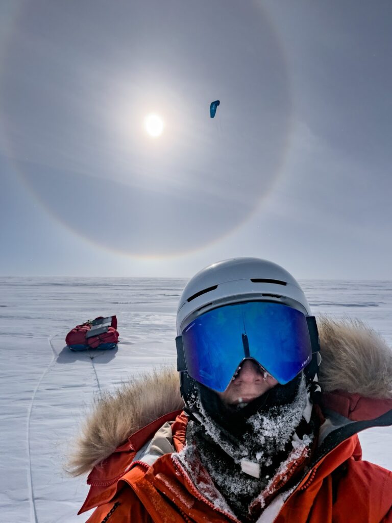 Kite skiing across Antarctica with a huge sun halo
